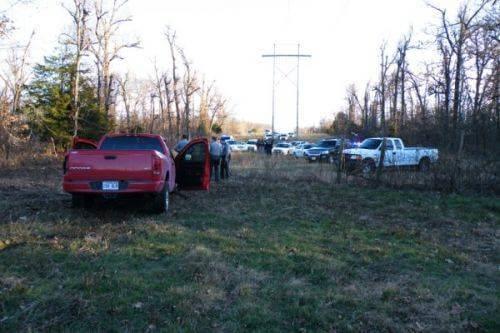 12-17-09 End of Felony Pursuit. Cops standing around a red truck.