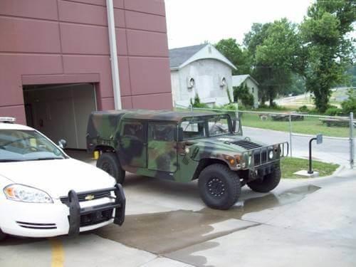 LCSO new humvee parked next to a patrol car.