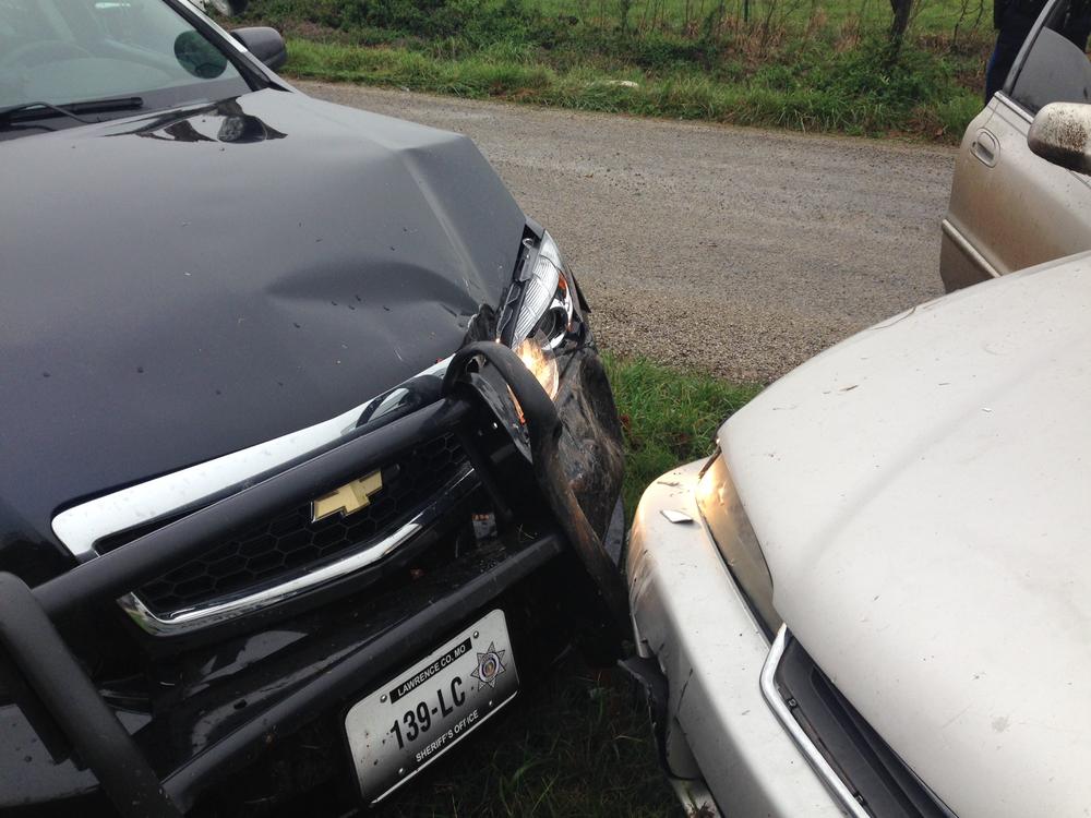 Front end of the deputy patrol car featuring damage