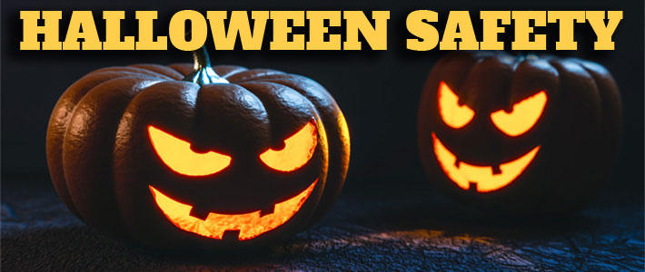 Halloween Safety in yellow letters with a grinning carved pumpkin