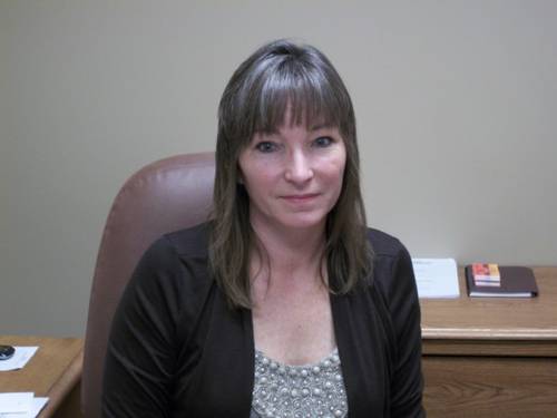 Kimberly Bishop-Jones sitting at her desk