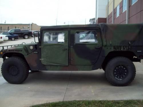 LCSO new humvee side view. The color of the humvee is a camo mix of brown, black and green.